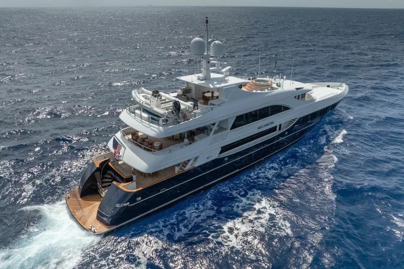 Slide: The Image of Luxurious 2006 Trinity Tri-Deck Motor Yacht cruising on open ocean waters. - 38