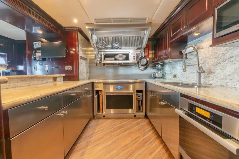 Slide: The Image of Luxurious kitchen in a 2006 Trinity Tri-Deck Motor Yacht with modern appliances. - 5