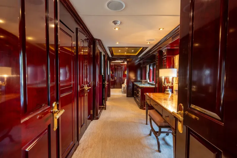 Slide: The Image of Luxurious interior hallway of 2006 Trinity Tri-Deck Motor Yacht with elegant wood paneling. - 7