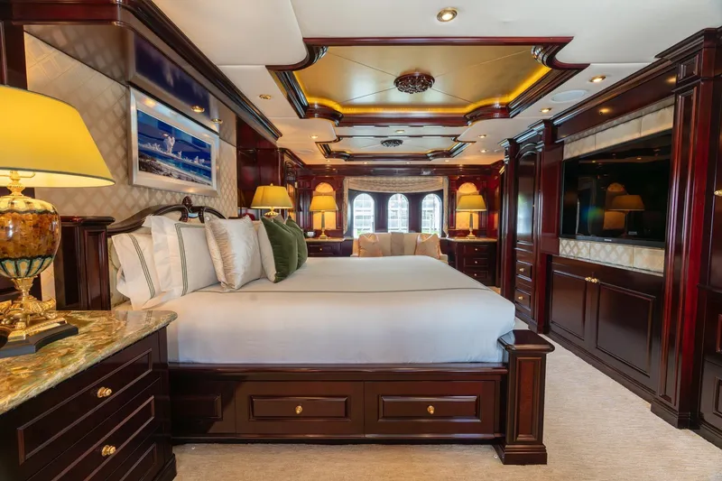 Slide: The Image of Luxurious bedroom interior on 2006 Trinity Tri-Deck Motor Yacht with elegant wood finishes. - 9