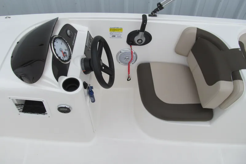 Slide: The Image of 2017 Bayliner Element E18 boat cockpit with steering wheel and seating. - 11