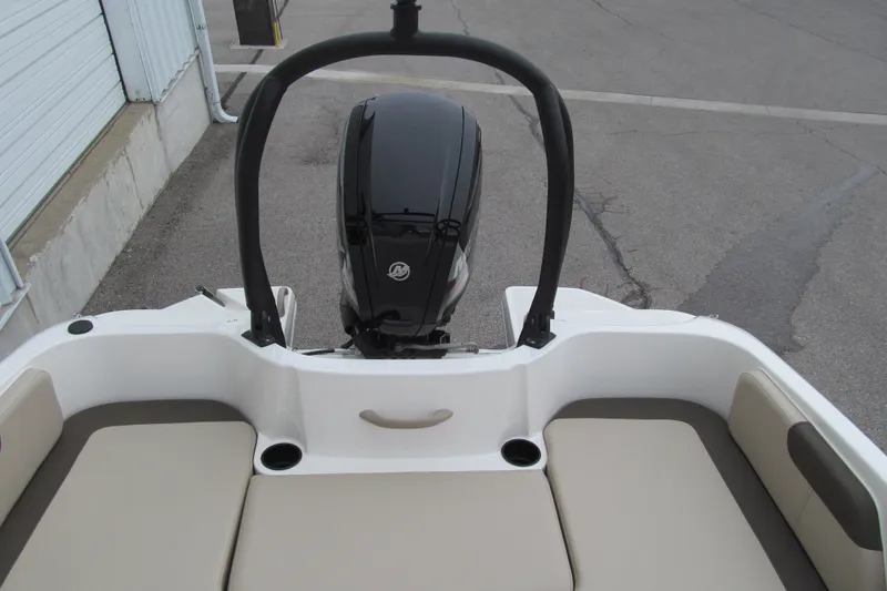 Slide: The Image of 2017 Bayliner Element E18 boat with outboard motor and seating area. - 13