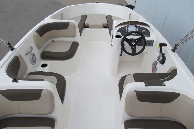 Slide: The Image of 2017 Bayliner Element E18 boat interior with seating and steering console. - 4