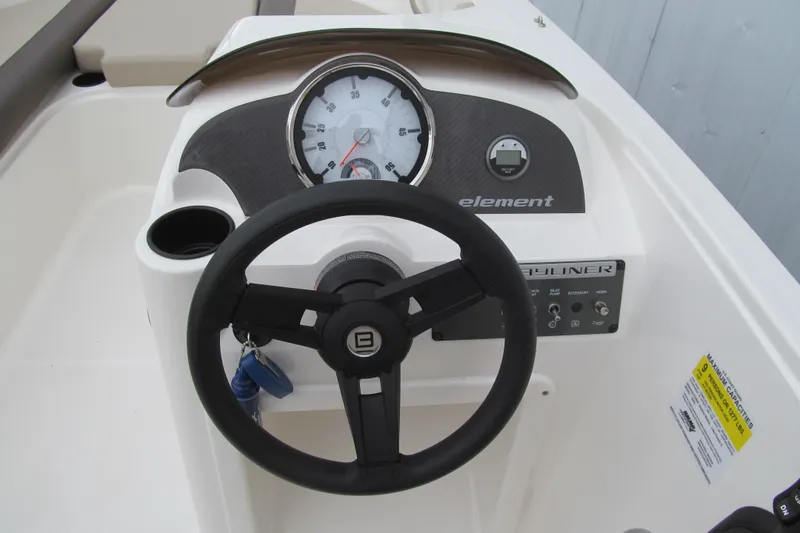 Slide: The Image of 2017 Bayliner Element E18 dashboard with steering wheel and instrument panel. - 5