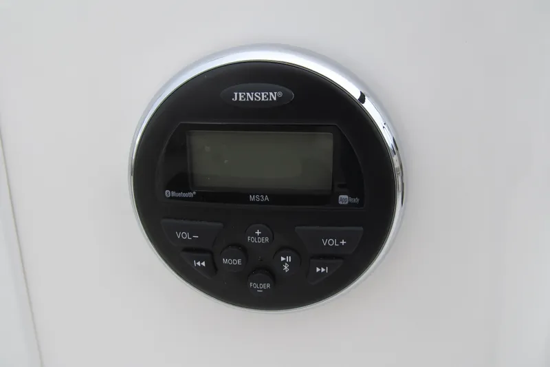 Slide: The Image of Jensen audio control panel on 2017 Bayliner Element E18 boat dashboard. - 7