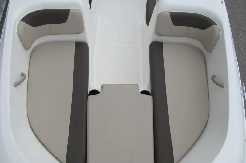 Slide: The Image of 2017 Bayliner Element E18 boat interior with beige and gray seating arrangement. - 8