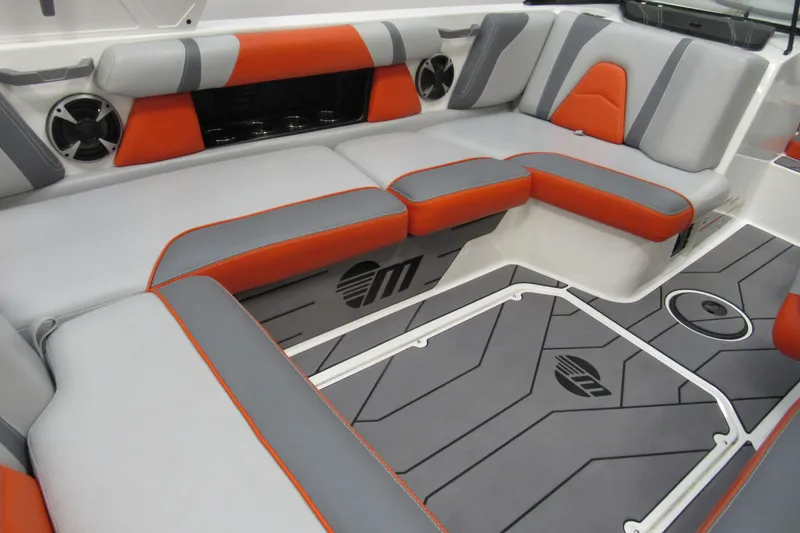 Slide: The Image of 2021 Malibu Wakesetter 21 VLX interior with gray and orange seating, stylish design. - 4