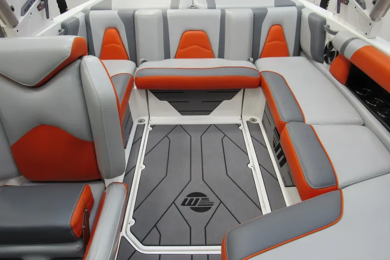 Slide: The Image of 2021 Malibu Wakesetter 21 VLX interior with gray and orange seating. - 9