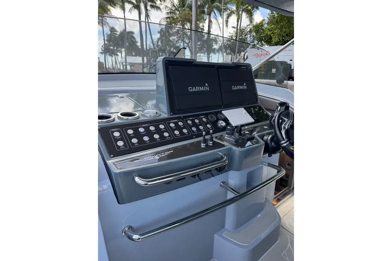 Slide: The Image of Helm of 2023 Canados 431 yacht with Garmin navigation displays and control panel. - 20