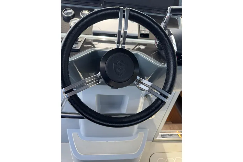 Slide: The Image of Steering wheel of 2023 Canados 431 yacht, featuring sleek design and modern controls. - 22