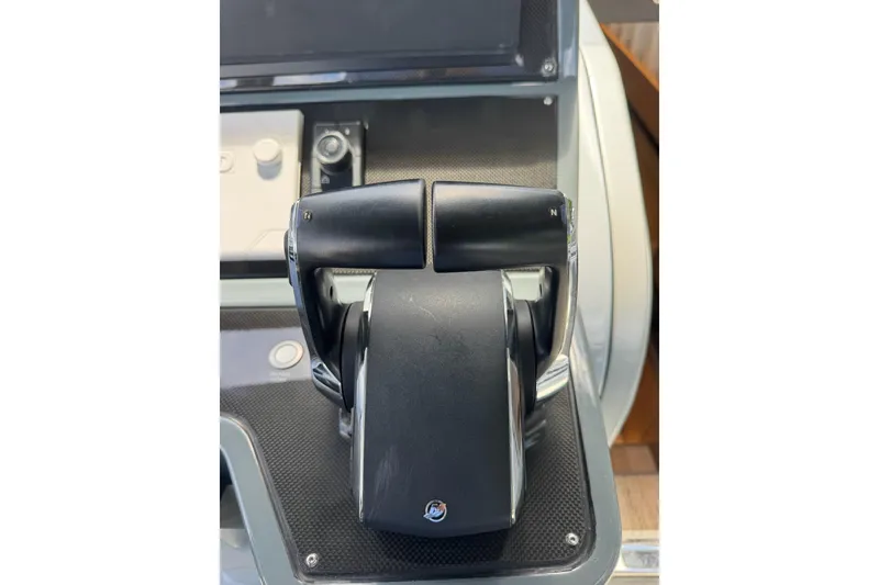 Slide: The Image of Throttle controls on a 2023 Canados 431 yacht dashboard. - 23
