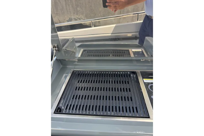 Slide: The Image of Built-in grill on 2023 Canados 431 yacht deck, featuring sleek design and modern controls. - 24