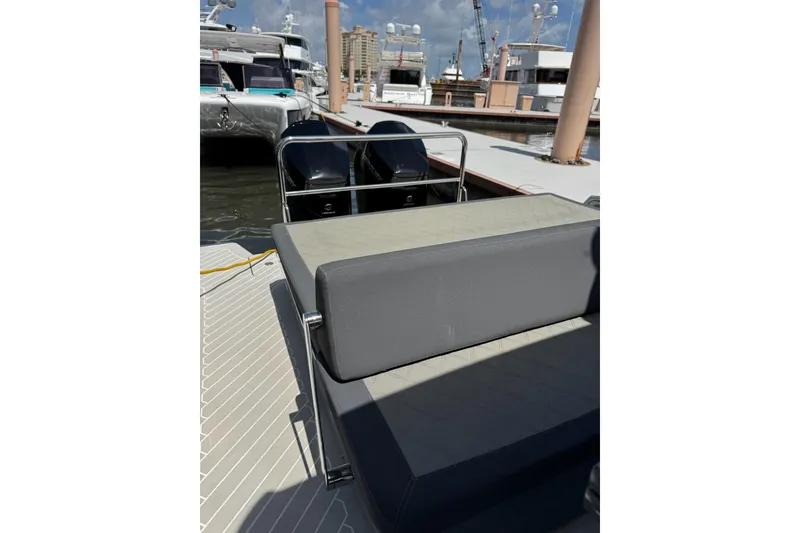 Slide: The Image of 2023 Canados 431 yacht at dock, featuring sleek seating and dual engines. - 26