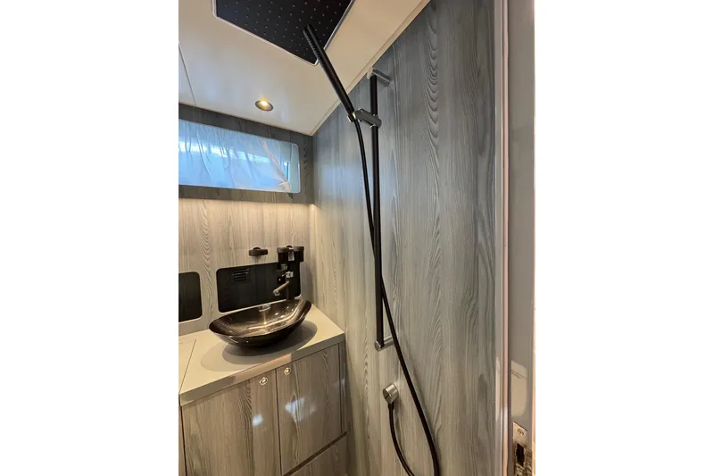 Slide: The Image of Modern bathroom interior of 2023 Canados 43 yacht with sleek fixtures and wood paneling. - 6