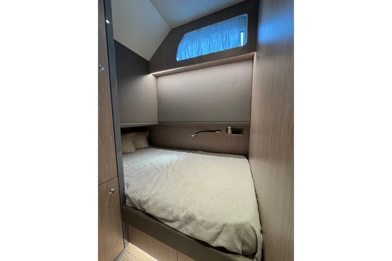 Slide: The Image of Cozy cabin interior of 2023 Canados 43 yacht with modern design and soft lighting. - 8