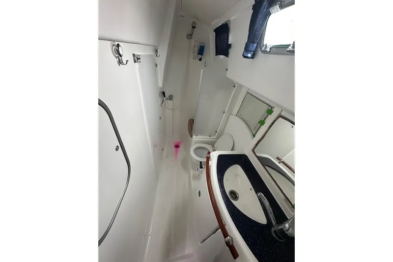 Slide: The Image of Bathroom interior of 2005 Beneteau Oceanis 42CC sailboat, featuring sink and toilet. - 18