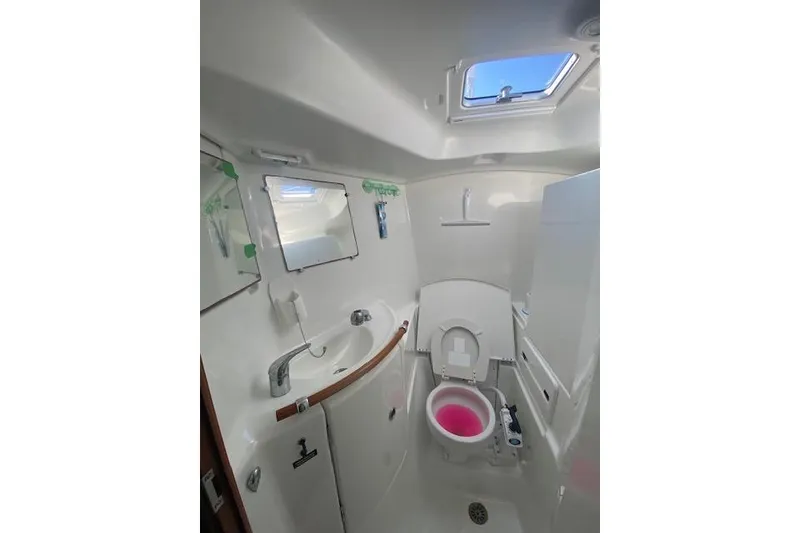 Slide: The Image of Bathroom interior of 2005 Beneteau Oceanis 42CC yacht, featuring sink and toilet. - 21