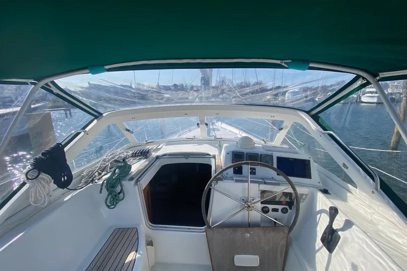 Slide: The Image of Cockpit view of 2005 Beneteau Oceanis 42CC sailboat with steering wheel and navigation instruments. - 27
