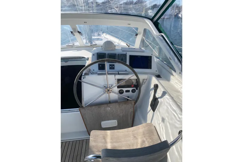 Slide: The Image of Cockpit of 2005 Beneteau Oceanis 42CC sailboat with steering wheel and navigation instruments. - 28