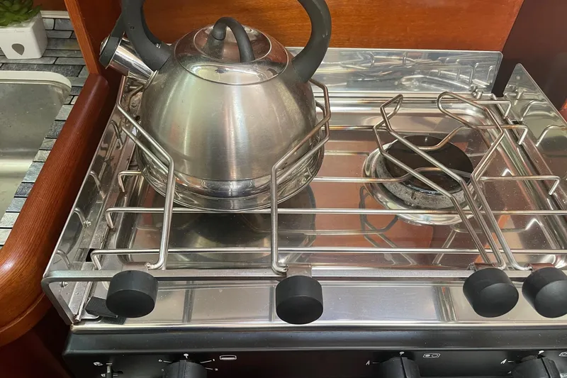 Slide: The Image of Stainless steel kettle on stove in 2005 Beneteau Oceanis 42CC yacht kitchen. - 7