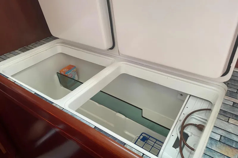 Slide: The Image of Open storage compartment in 2005 Beneteau Oceanis 42CC yacht interior. - 9