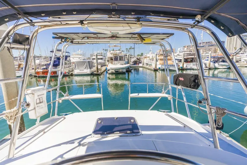Slide: The Image of View from the helm of a 2000 Hunter Passage 420 sailboat in a marina. - 15