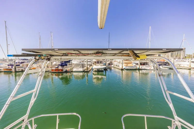 Slide: The Image of Hunter Passage 420 sailboat docked in marina, clear blue sky, calm water, 2000 model. - 16