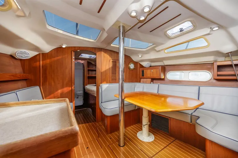 Slide: The Image of Interior of 2000 Hunter Passage 420 yacht with wooden furnishings and skylights. - 19