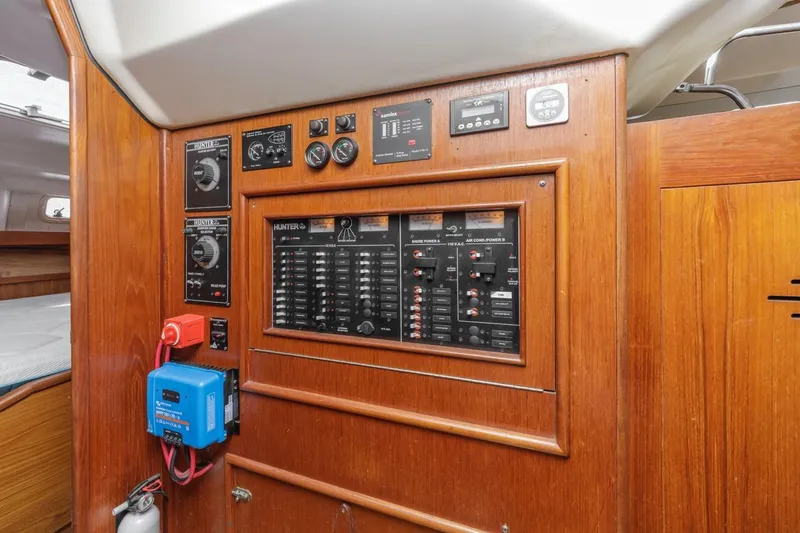 Slide: The Image of Electrical control panel inside a 2000 Hunter Passage 420 sailboat cabin. - 29