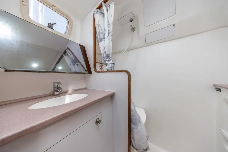 Slide: The Image of Bathroom interior of 2000 Hunter Passage 420 yacht with sink and shower. - 33