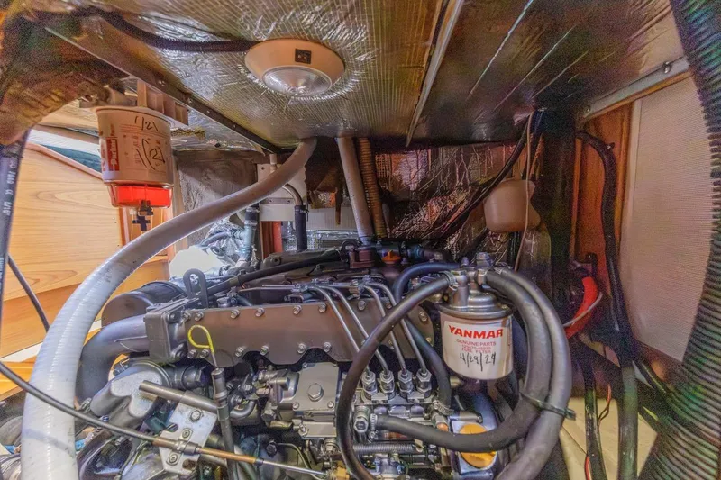 Slide: The Image of Engine compartment of a 2000 Hunter Passage 420 sailboat, featuring Yanmar parts. - 35