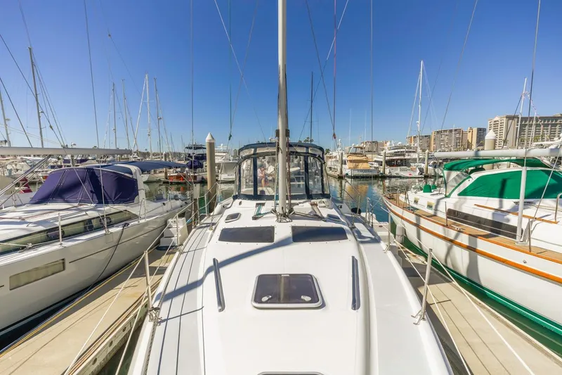Slide: The Image of Hunter Passage 420 sailboat docked in a marina, surrounded by other boats. - 7
