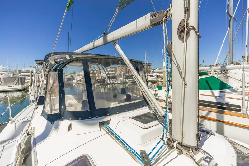 Slide: The Image of Sailboat Hunter Passage 420, 2000 model, docked in a marina under clear blue skies. - 8