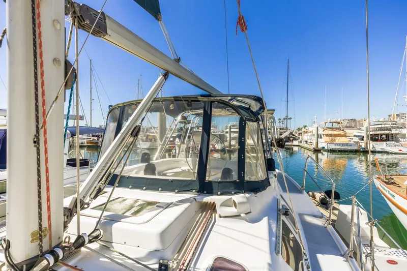 Slide: The Image of Sailboat Hunter Passage 420, 2000 model, docked in a sunny marina. - 9