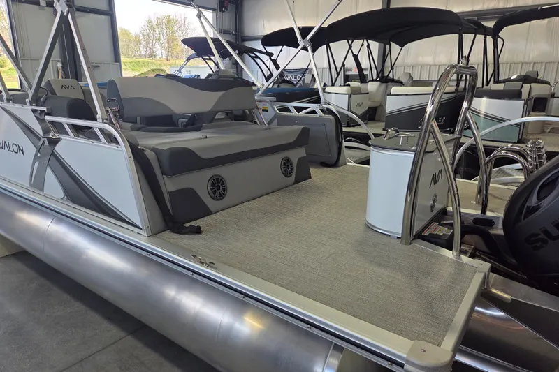 Slide: The Image of 2026 Avalon LSZ 2185 Cruise Rear Bench pontoon boat in showroom. - 9