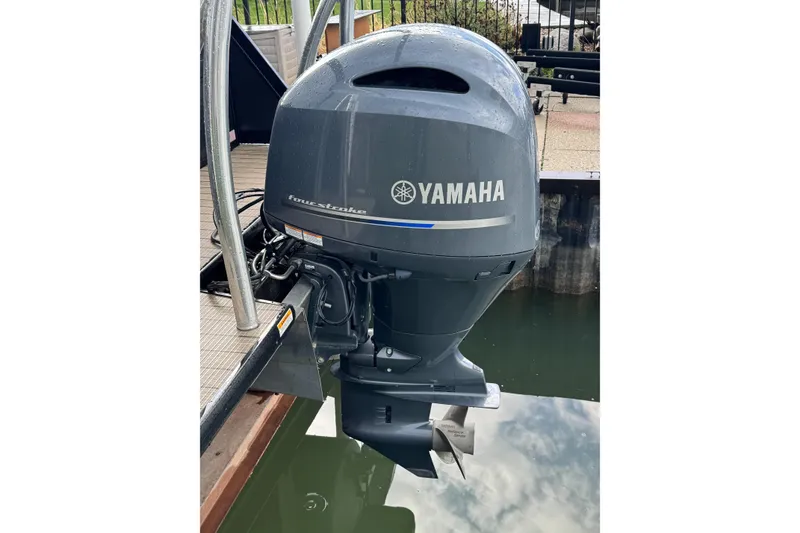 Slide: The Image of Yamaha four-stroke outboard motor on a 2022 Viaggio Diamante 23 U boat. - 16