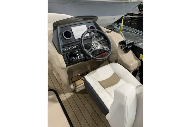 Slide: The Image of 2023 Viaggio Diamante 23 U boat cockpit with steering wheel and control panel. - 2