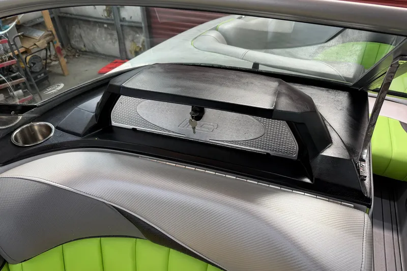 Slide: The Image of Interior of 2015 MB B-52 23 Widebody boat with green and gray seating. - 15