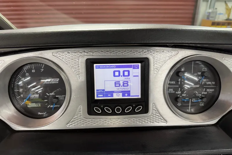 Slide: The Image of Dashboard of 2015 MB B-52 23 Widebody boat with digital and analog gauges. - 22