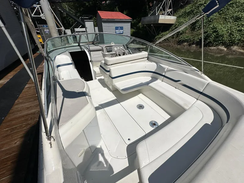 Slide: The Image of 2000 Formula 330 SS boat with spacious white seating and sleek design. - 10