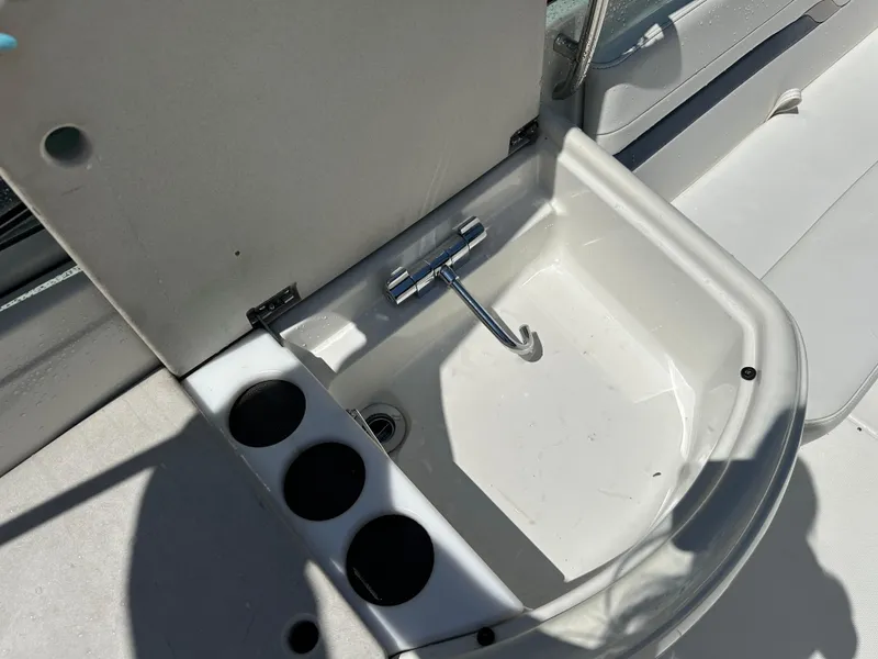 Slide: The Image of 2000 Formula 330 SS boat sink with cup holders and closed lid. - 16