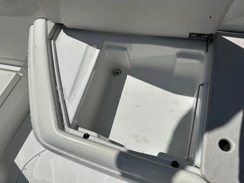 Slide: The Image of Open storage compartment on a 2000 Formula 330 SS boat, showing clean interior space. - 17