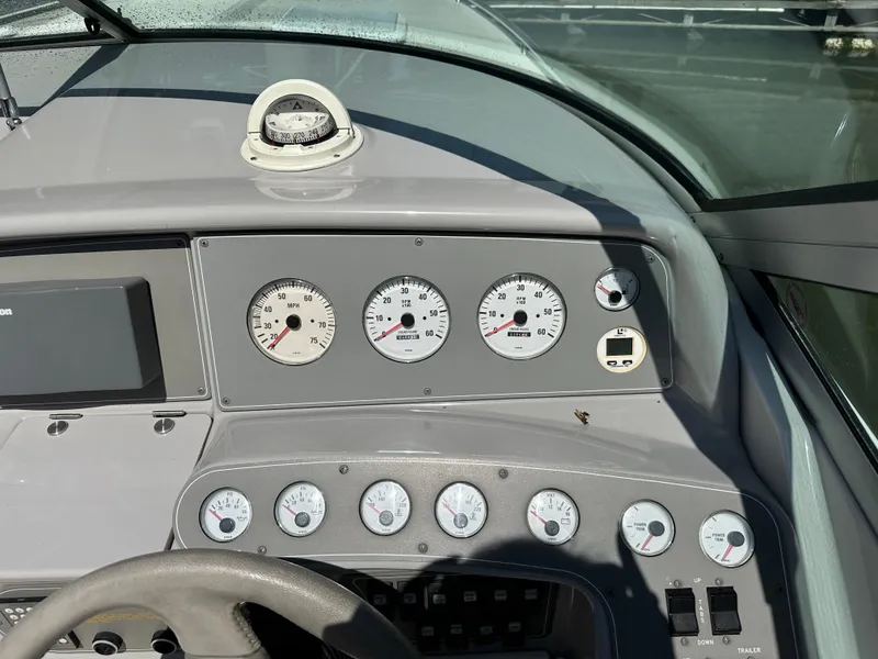 Slide: The Image of Dashboard of a 2000 Formula 330 SS boat with gauges and compass. - 21