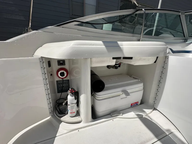 Slide: The Image of Storage compartment on a 2000 Formula 330 SS boat with cooler and fire extinguisher. - 28
