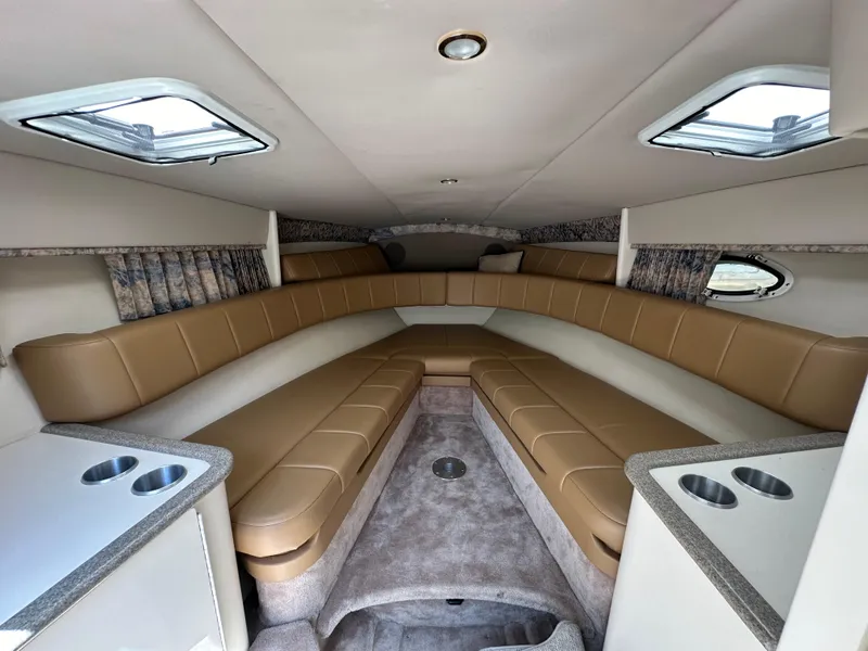 Slide: The Image of Interior of 2000 Formula 330 SS boat with tan seating and skylights. - 33