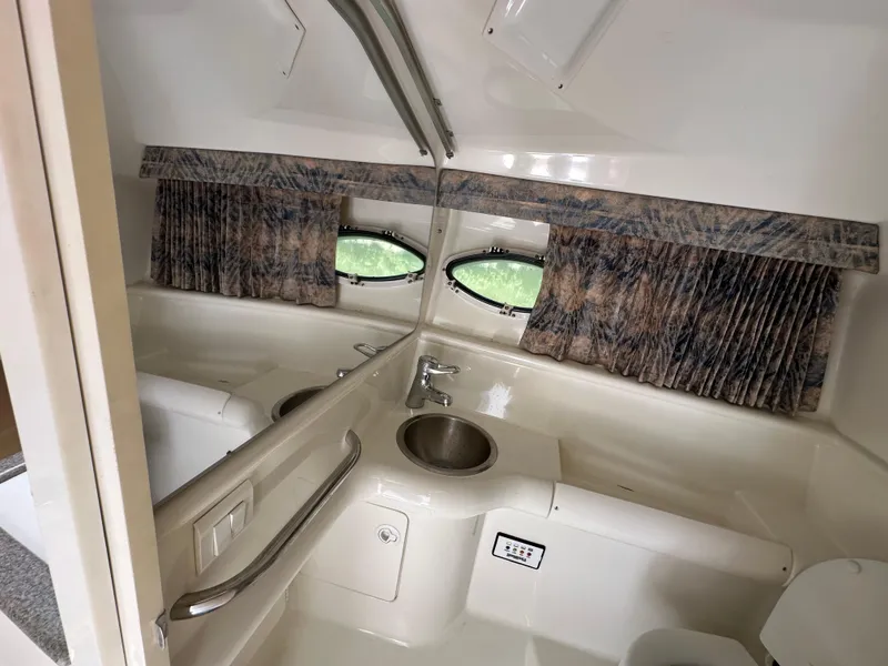 Slide: The Image of Interior of 2000 Formula 330 SS boat with sink and curtains. - 45
