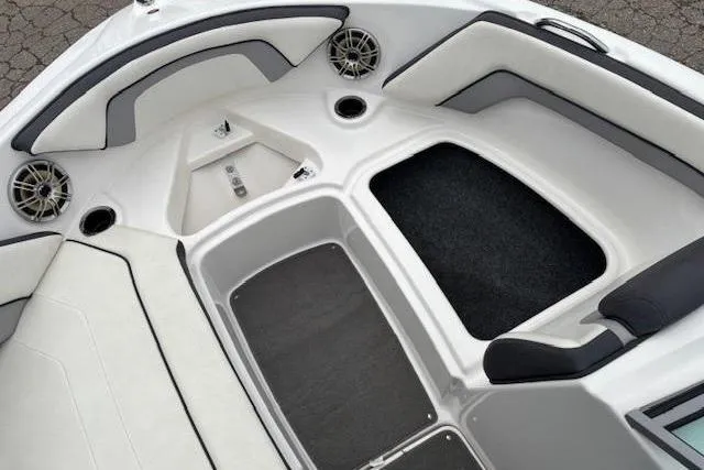 Slide: The Image of 2015 Yamaha Boats SX192 interior with cushioned seating and speaker system. - 10