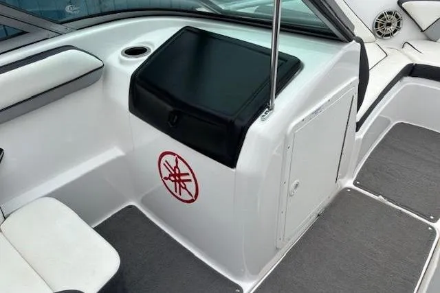 Slide: The Image of 2015 Yamaha Boats SX192 interior with seating and storage compartment. - 11