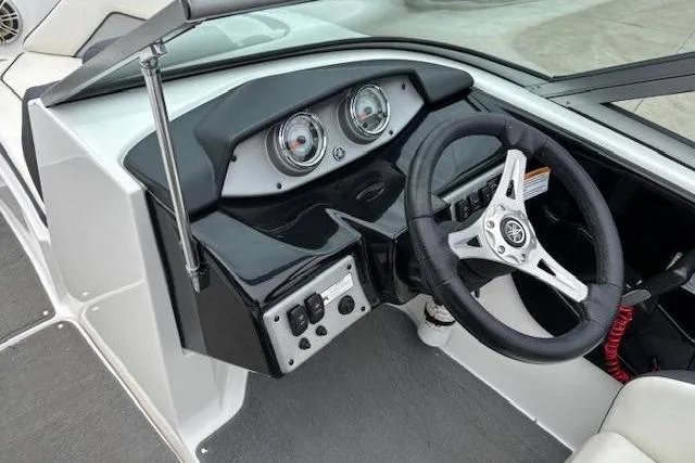 Slide: The Image of 2015 Yamaha Boats SX192 dashboard with steering wheel and instrument panel. - 14