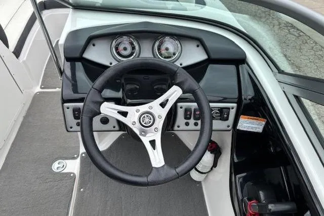 Slide: The Image of 2015 Yamaha Boats SX192 dashboard with steering wheel and instrument panel. - 15